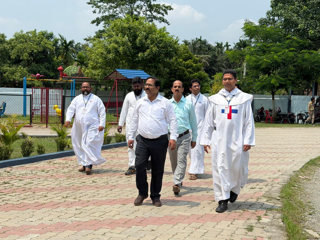 Management team walking toward DeMatha School